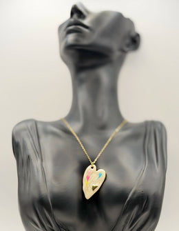 Close-up of premium hypoallergenic imitation jewelry featuring a hand-painted heart.