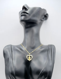 Biya Accessoires sacred heart medallion necklace with 18K gold plating and crystals.