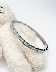 Modern luxury fine art editorial jewelry snake scale pave bracelet gift for her.